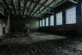 Dark creepy ruined gymnasium in abandoned school