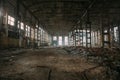 Dark creepy ruins of demolished abandoned large industrial warehouse or hangar of Soviet factory Royalty Free Stock Photo