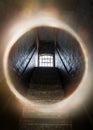 Dark and creepy window open at top of old stone stairs