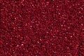 Dark crimson, red glitter background, macro photo.