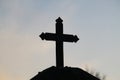 Dark cross from the entrance of a cemetery Royalty Free Stock Photo