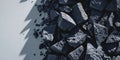 Dark crushed stones with sharp angular surfaces and dense texture.