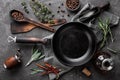 Dark culinary background with empty black pan Royalty Free Stock Photo