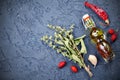 Dark culinary background with olive oil, pepper