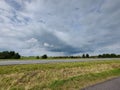 Dark cumulus clouds over the farmland of the Krimpenerwaard Royalty Free Stock Photo