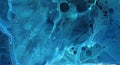 Dark deep indigo alcohol ink neon abstract background. Bright glowing flow blue liquid watercolor paint splash texture Royalty Free Stock Photo