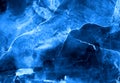 Dark deep indigo alcohol ink neon abstract background. Bright glowing flow blue liquid watercolor paint splash texture Royalty Free Stock Photo