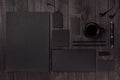 Dark deluxe black branding stationery, mockup scene with phone, coffee on black wooden plank. Royalty Free Stock Photo