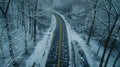 A dark deserted road with icy patches tered throughout warning of black ice ahead. Bare leafless trees frame the scene Royalty Free Stock Photo