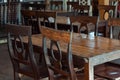 Dark dining table with wooden chair and vintage restaurant
