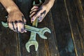 Dark dirty man hands holding professional working tools f Royalty Free Stock Photo