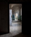Dark doorway in an old abandoned hallway during the day Royalty Free Stock Photo