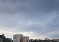 Dark dramatic clouds above on the city