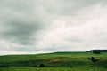 Dark dramatic rainy sky clouds over agricultural rural landscape Royalty Free Stock Photo