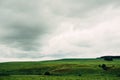 Dark dramatic rainy sky clouds over agricultural rural landscape