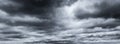 Dark dramatic sky and clouds. Background for death and sad concept. Gray sky and fluffy white clouds. Thunder and storm sky. Sad