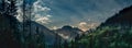 Dark and dramatic view on the mountain peak in the valley.