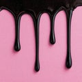 Glossy Black Drips on Pink Textured Surface Royalty Free Stock Photo