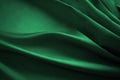 Dark emerald green silk satin. Soft folds. Fabric. Luxury background for design. Royalty Free Stock Photo