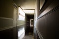 Dark and empty corridor with available natural light from window Royalty Free Stock Photo