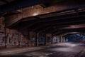 Dark empty dirty grunge underground concrete tunel with a road during mystic night with blue street Royalty Free Stock Photo