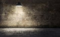 Dark empty room with old damaged concrete wall and ceiling lamp Royalty Free Stock Photo