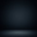 A dark, empty space with a subtle gradient from black to dark gray. The surface appe Royalty Free Stock Photo