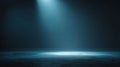 Dark empty studio background with soft blue spotlight, subtle fog, and cinematic gradient lighting. Royalty Free Stock Photo