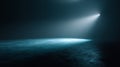 Dark empty studio background with soft blue spotlight, subtle fog, and cinematic gradient lighting. Royalty Free Stock Photo
