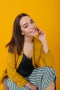 Dark-eyed cheerful woman in fashionable attire posing in studio. Laughing gorgeous caucasian girl s