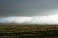 Dark funnel cloud over grassland in Kansas