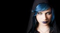 Dark girl with yellow cats eyes, blue hair and black hood Royalty Free Stock Photo