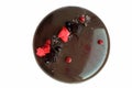 Dark glazed chocolate cake with berries on white background Royalty Free Stock Photo