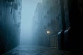 dark gloomy city street at night. background for crime. dark foggy abandoned city with glowing light, crime dark background Royalty Free Stock Photo