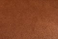 Dark gold copper glitter texture background. Brown glitter