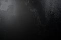 Dark grainy abstract texture with deep black and muted gray gradient noise effects Royalty Free Stock Photo