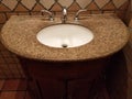 Dark granite bathroom sink with cabinet Royalty Free Stock Photo
