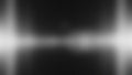 A dark gray abstract background with a blurred white light effect and textured surface creates a sense of depth and mystery in Royalty Free Stock Photo