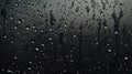 A dark gray background of raindrops on glass
