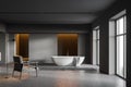 Dark gray bathroom, tub and armchair Royalty Free Stock Photo