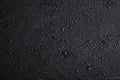 Dark gray black slate background with water drops or natural stone texture. Royalty Free Stock Photo