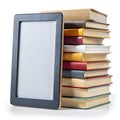 E reader device next to stack of colorful hardcover books on white background e-book tablet Royalty Free Stock Photo