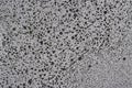 Dark gray foam concrete close-up, texture, background, material with copy space.