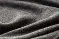 Dark gray jersey folded textile texture background