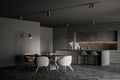 Dark gray kitchen corner with bar and dining table Royalty Free Stock Photo