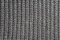 Dark gray knitting texture background or knitted pattern background.