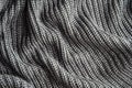 Dark gray knitting texture background or knitted pattern background.