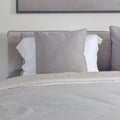 Dark gray pillow with comfy bed in modern bedroom Royalty Free Stock Photo