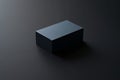Dark gray rectangular block resting on dark gray surface, minimal studio product shot, simple clean background Royalty Free Stock Photo
