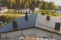 dark gray roof of an industrial building made of metal. Corrugat